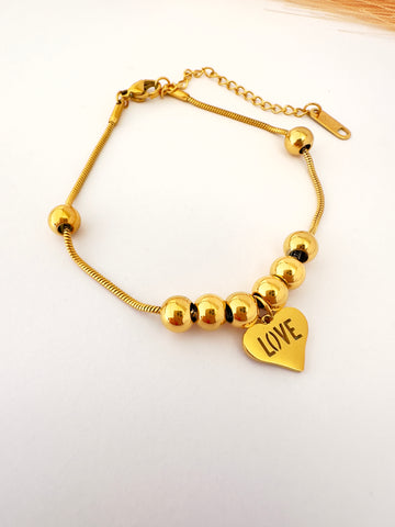 ✨ Pulsera Dorada Love Esferas